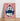 Almanac Co Prints 'Feed Me' poster in pale pink and blue, framed and leaning against a white wall on a wooden floor."